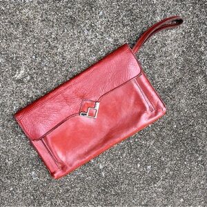 Vintage 1970’s boho orange leather clutch wristlet